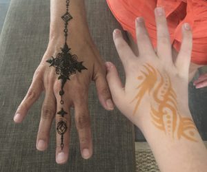 Image of two hands with henna applied
